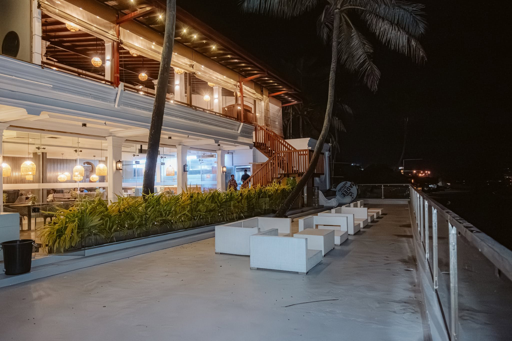 Madeena restaurant and ocean terrace at night